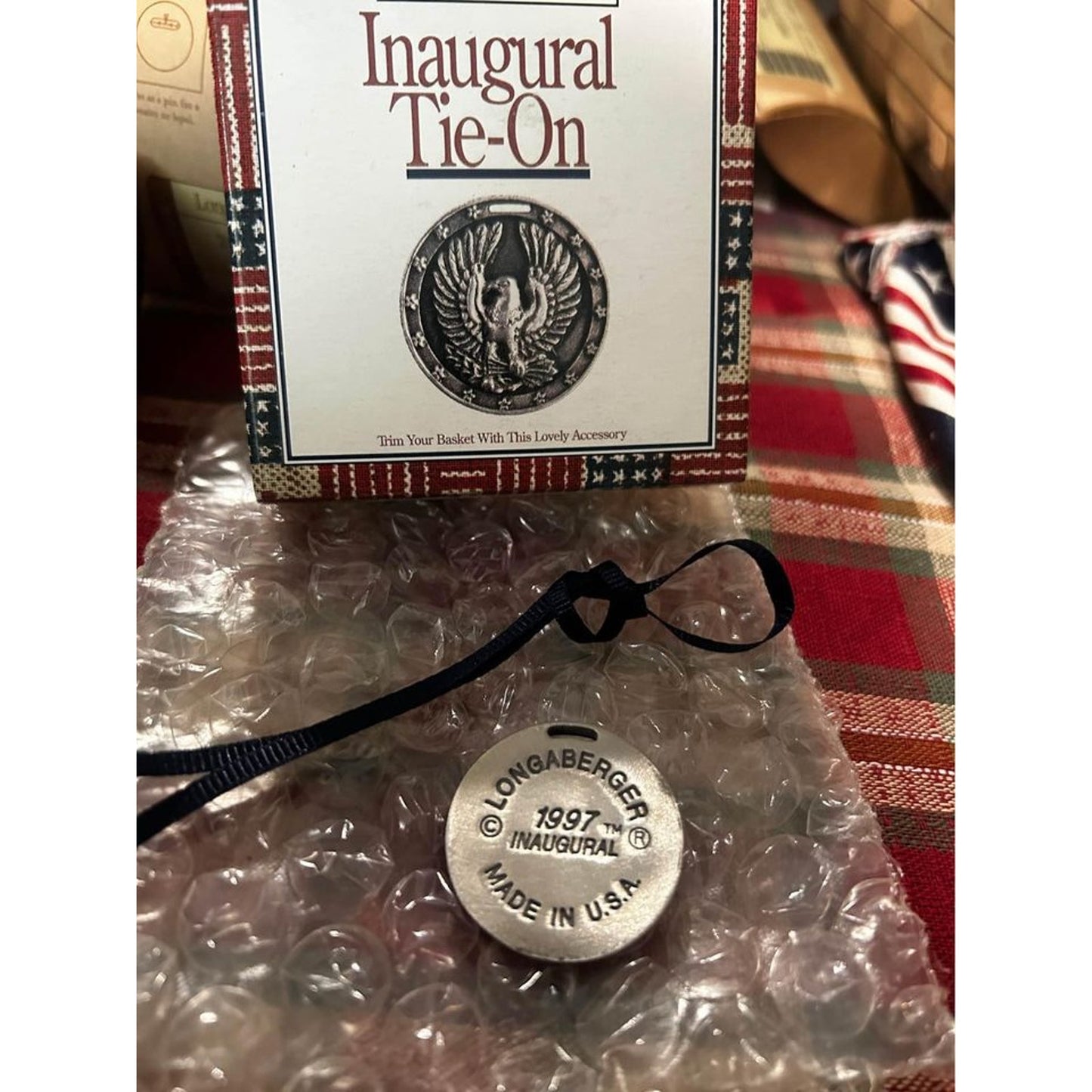 Longaberger Basket tie on round metal made in USA 1997 inaugural NEW